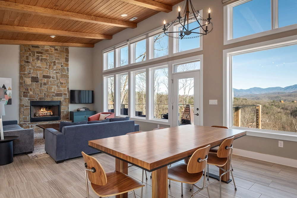 cabin living room with a fireplace and mountain view
