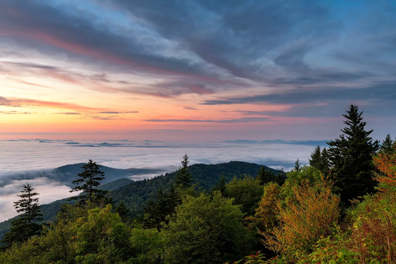 view of Smoky Mountain landscape from mountain peak at sunrise
