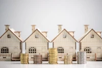 model homes with coins in front